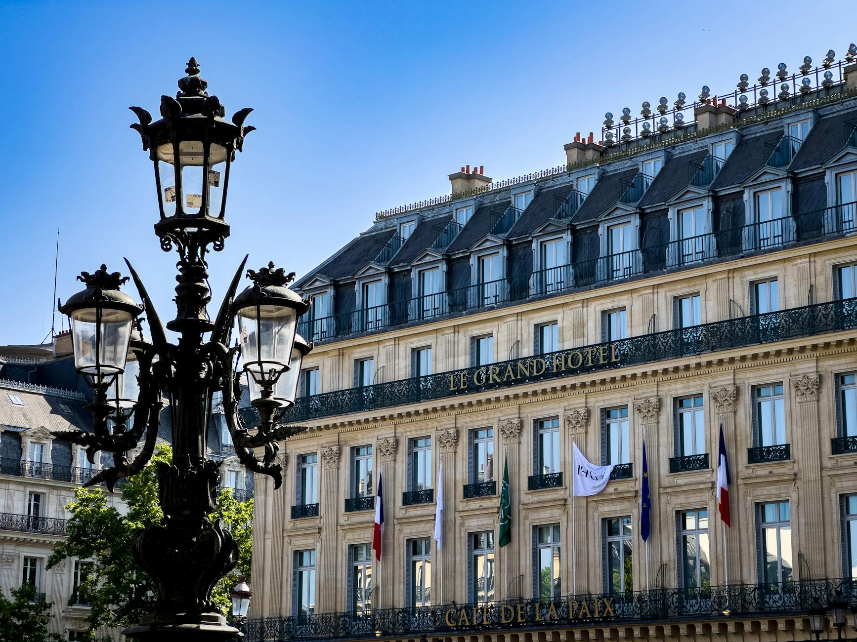 elegant facade of le grand hotel in paris